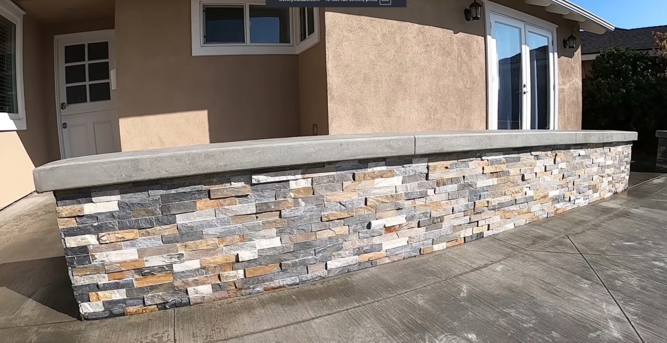 Custom outdoor fireplace and kitchen construction with stone veneer in Vallejo, CA